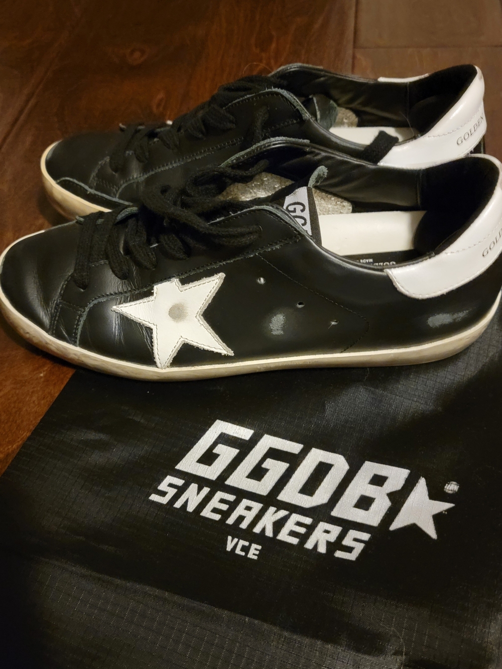 Golden Goose Black Sneakers with White Star Detail With The Worn In Look